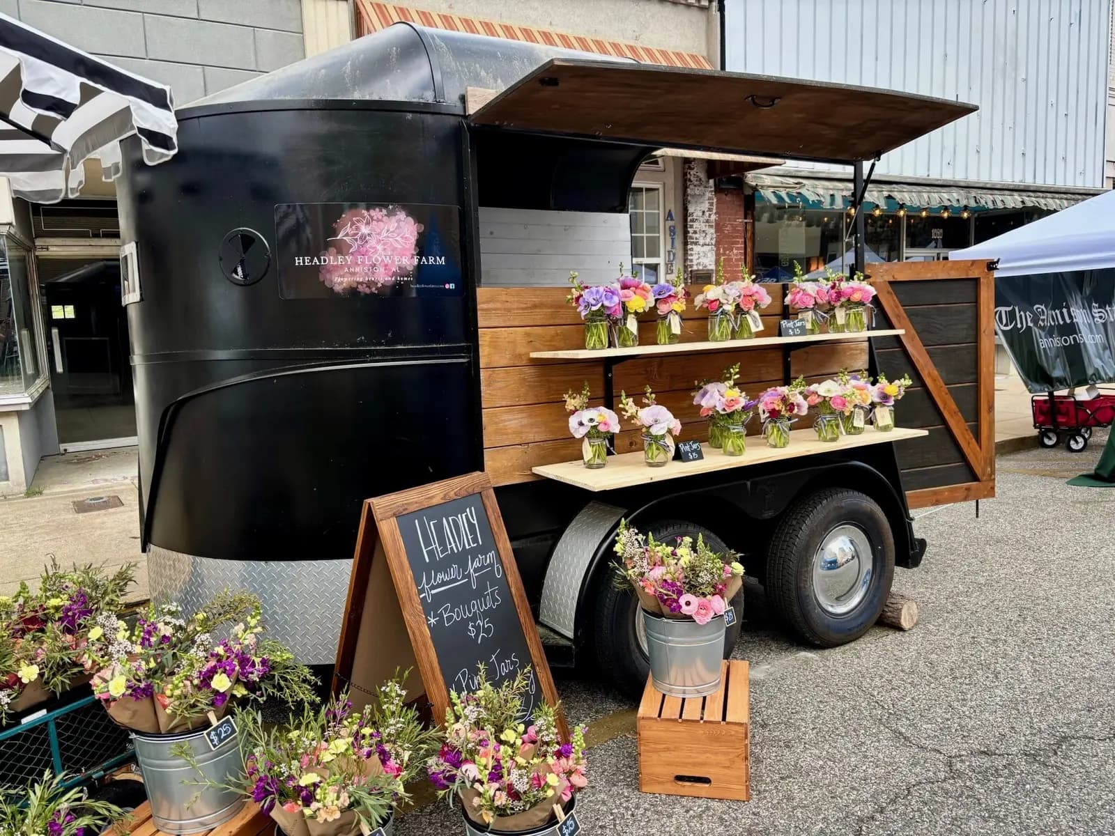 Headley Flower Farm trailer at a local market with fresh flower arrangements