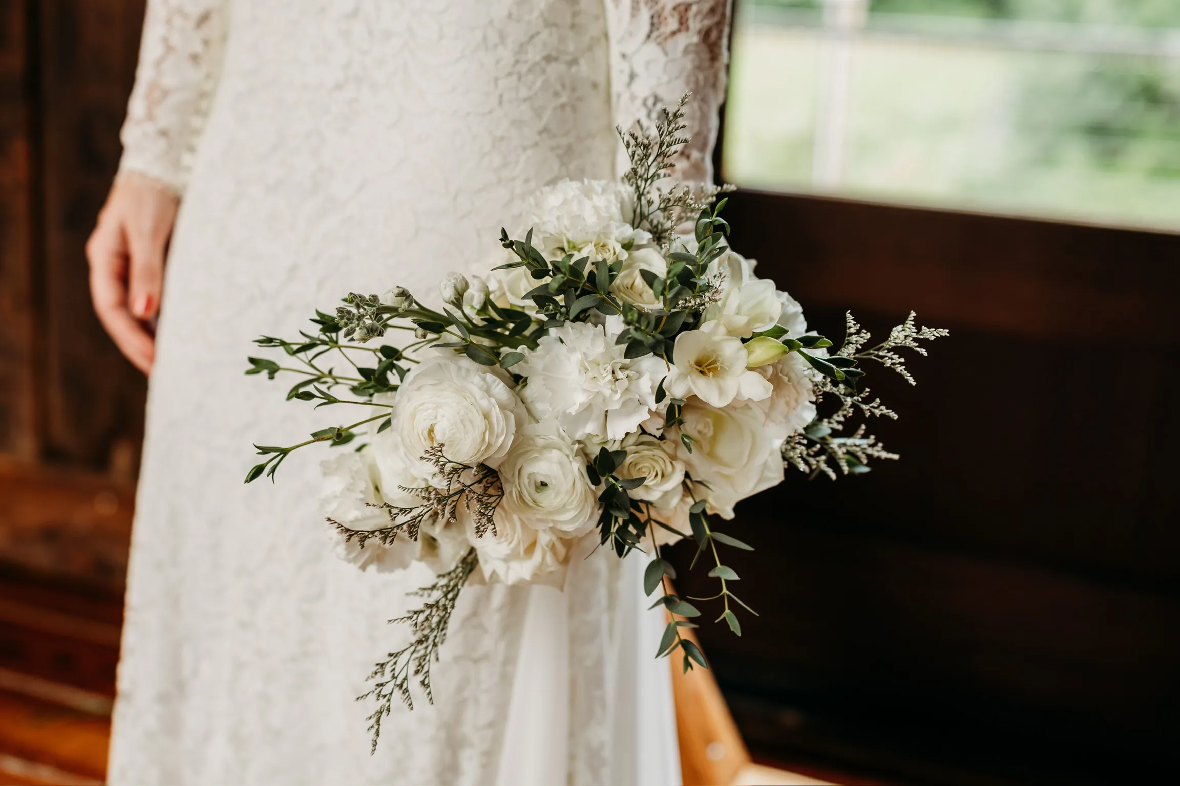 Elegant white bridal bouquet with greenery