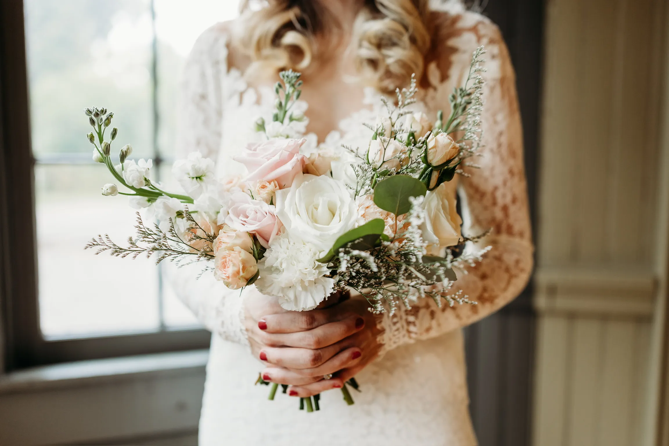 Bride holding a lush garden-style bridal bouquet